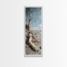 Carregar imagem no visualizador da galeria, Framed Canvas Print Skinny Art of a Weathered Driftwood Tree Trunk on a Sandy Shore with a Calm Ocean Backdrop, Ideal Tall Art for Coastal Decor
