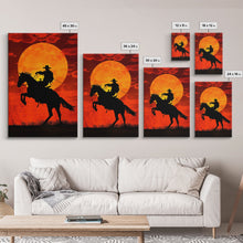Load image into Gallery viewer, Cowboy Riding Horse into the Sunset | Framed Canvas Print | Western Silhouette Art | Rustic Cowboy Wall Art for Living Room
