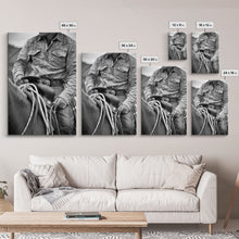 Load image into Gallery viewer, Close-up of cowboy hands holding reins, detailed Western art, black and white photography, Framed Canvas Print, rustic home decor, wall art
