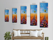 Load image into Gallery viewer, Colorful Wildflowers in a Field with a Lone Tree Under a Bright Blue Sky on a Framed Canvas Print Tall Art Piece
