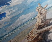 Carregar imagem no visualizador da galeria, Framed Canvas Print Tall Art Featuring a Piece of Driftwood on a Sandy Beach with Bright Blue Sky and Ocean Waves, Ideal Skinny Art for Coastal Homes
