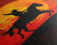 Load image into Gallery viewer, Cowboy Silhouette on Horseback at Sunset | Framed Canvas Print | Western Landscape Art | Rustic Cowboy Wall Art for Living Room
