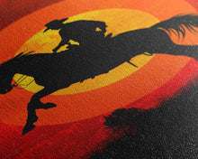 Load image into Gallery viewer, Cowboy on Horse with Dramatic Sunset Background | Framed Canvas Print | Western Silhouette Art | Sunset Cowboy Wall Art for Bedroom
