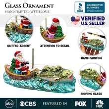 Load image into Gallery viewer, Santa&#39;s Fishing Adventure Glass Christmas Ornament, Holiday Angler Fish in Sleigh
