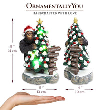 Load image into Gallery viewer, Whimsical Bigfoot Behind Christmas Tree Figurine, 7.5&quot; Funny Holiday Yeti LED Statue, He Sees You When You&#39;re Sleeping
