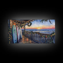 Carregar imagem no visualizador da galeria, Beachfront porch with surfboards and Christmas lights, Framed Canvas Print with wreaths festive lights, coastal holiday wall art and decor
