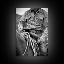 Load image into Gallery viewer, Close-up of cowboy hands holding reins, detailed Western art, black and white photography, Framed Canvas Print, rustic home decor, wall art
