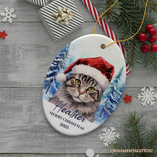 Load image into Gallery viewer, Tabby Cat with Santa Hat Personalized Ornament, Winter Forest Christmas Gift With Custom Name and Date
