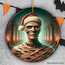 Carregar imagem no visualizador da galeria, Ancient Mummy with Santa Hat Ornament, Enigmatic Holiday Gift for Horror Enthusiasts
