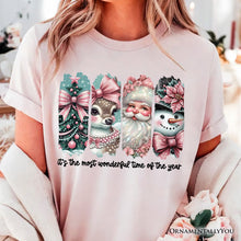 Load image into Gallery viewer, Coquette Pink Christmas T‑Shirt, It&#39;s The Most Wonderful Time Of The Year Vintage Tree, Reindeer, Santa and Snowman Tee
