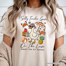 Carregar imagem no visualizador da galeria, Last Day Teacher Goose T-Shirt, Tropical Summer Break Navy, White, and Natural Tee for Fun and Quirky Educators
