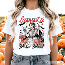 Load image into Gallery viewer, Licensed to Draw Blood Halloween Nurse T-Shirt, Groovy Tee for Spooky Season
