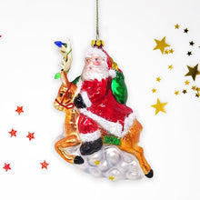 Load image into Gallery viewer, Santa Riding Reindeer Glass Christmas Ornament
