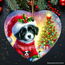 Carregar imagem no visualizador da galeria, Playful Border Collie with Santa Hat Ornament, Festive Canine Christmas Decor
