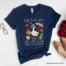 Carregar imagem no visualizador da galeria, Last Day Teacher Goose T-Shirt, Tropical Summer Break Navy, White, and Natural Tee for Fun and Quirky Educators
