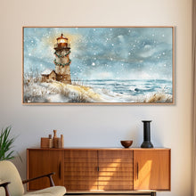 Load image into Gallery viewer, Coastal Christmas Lighthouse Decor Framed Canvas Print, Snowy Beach Scene with Holiday Wreath and Lighthouse Winter Wall Art
