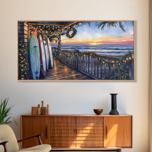 Carregar imagem no visualizador da galeria, Beachfront porch with surfboards and Christmas lights, Framed Canvas Print with wreaths festive lights, coastal holiday wall art and decor

