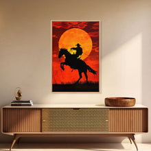 Load image into Gallery viewer, Cowboy Riding Horse into the Sunset | Framed Canvas Print | Western Silhouette Art | Rustic Cowboy Wall Art for Living Room

