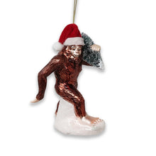 Carregar imagem no visualizador da galeria, Holiday Forest Dweller Bigfoot Glass Christmas Ornament, Yeti and Sasquatch Tree Thief
