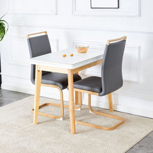 Load image into Gallery viewer, White stone burning tabletop with rubber wooden legs, foldable computer desk, foldable office desk, Modern PU leather high back cushion side chair with wood grain metal legs.
